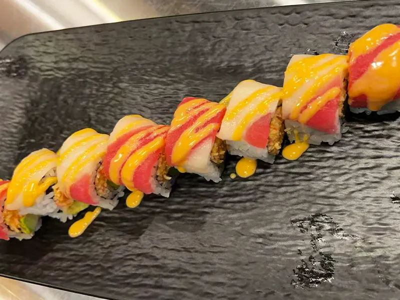 Creamy salmon sushi roll with rich sauce at Toyama Sushi Steahouse, a Japanese Restaurant in Dacula