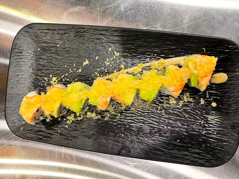 Crunchy sushi roll with avocado and crispy bits at Toyama Sushi Steahouse, a Japanese Restaurant in Dacula