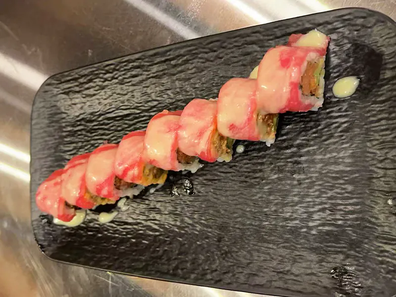 Melty cheese topped tuna sushi roll at Toyama Sushi Steahouse, a Japanese Restaurant in Dacula